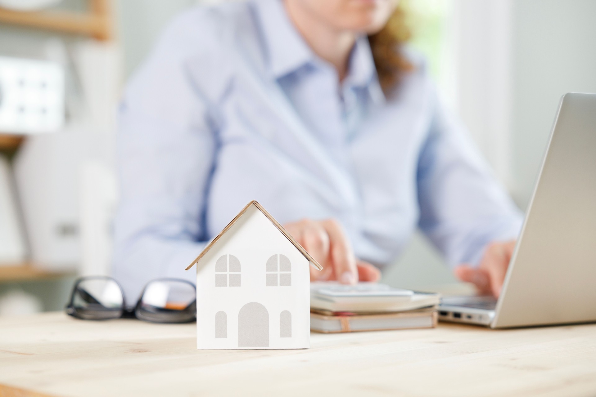Businesswoman making home mortgage loan repayment plan